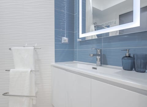 Apartment, 2 Bedrooms (Giglio) | Bathroom | Shower, free toiletries, hair dryer, bathrobes