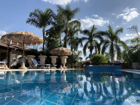 Outdoor pool, pool umbrellas, sun loungers