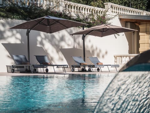 Outdoor pool, open 8:00 AM to 8:00 PM, pool umbrellas, sun loungers