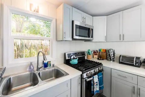 Chef-preferred gas stove/oven, microwave, double sink, dishwasher.