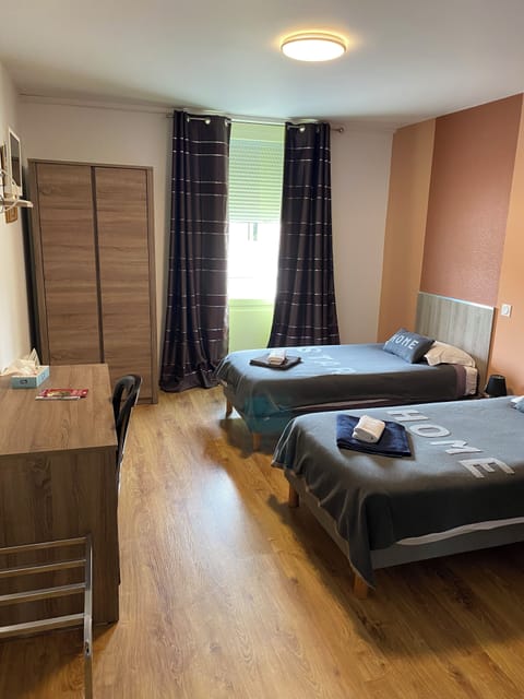 Twin Room | Individually decorated, individually furnished, desk, blackout drapes