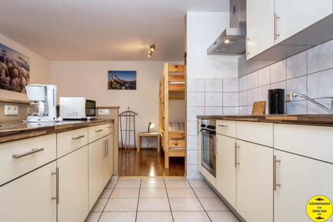 Family Apartment | Private kitchen | Fridge, microwave, oven, stovetop