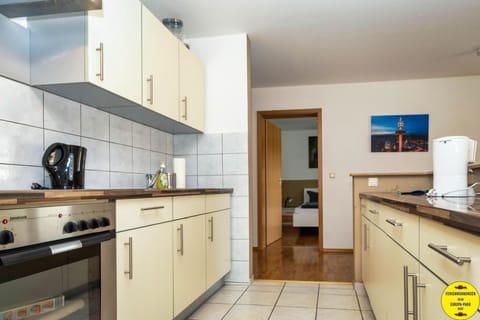 Family Apartment | Private kitchen | Fridge, microwave, oven, stovetop