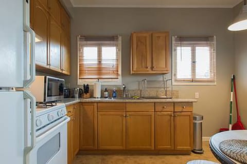 Fully equipped kitchen, stove, refrigerator, pans & pots, utensils, coffee maker