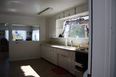 Welcome to the kitchen, fully stocked with dishes and cookware.