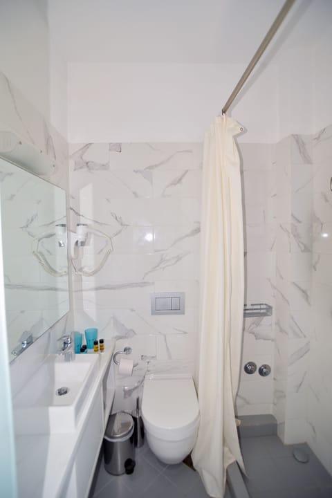 Shower, rainfall showerhead, hair dryer, towels