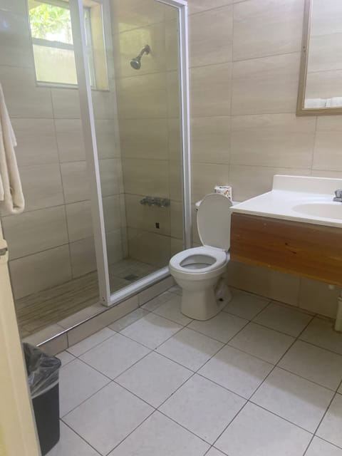 Standard Room, Ocean View | Bathroom | Combined shower/tub, hair dryer, towels