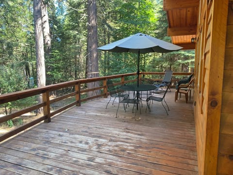 Spacious deck with forest view. Enjoy your morning coffee or a quiet evening