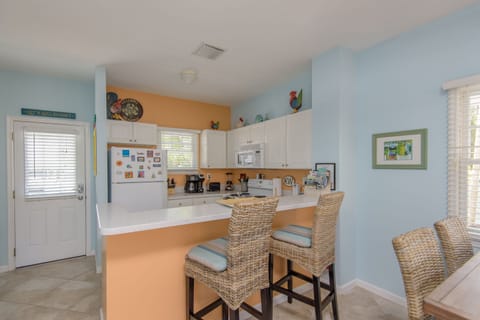 Kitchen with bar open to living area