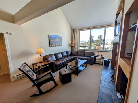 Spacious living room with mountain range views