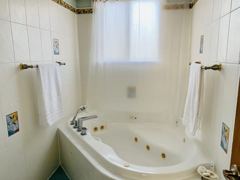Bathtub, jetted tub, hair dryer, bathrobes