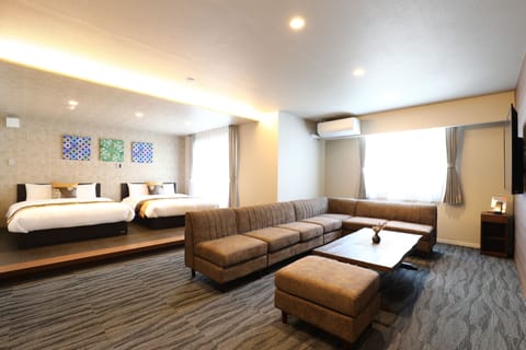 Superior Room (301) | Living area | Flat-screen TV