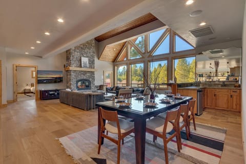 - Spacious dining area opens to kitchen and living with forest views
- Natural light fills the room for bright and welcoming meals
- Seamless flow between spaces ideal for group gatherings