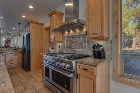 - Fully equipped kitchen with premium stainless steel appliances
- Granite countertops and custom cabinetry for easy meal prep
- Perfect space to cook and gather with family and friends