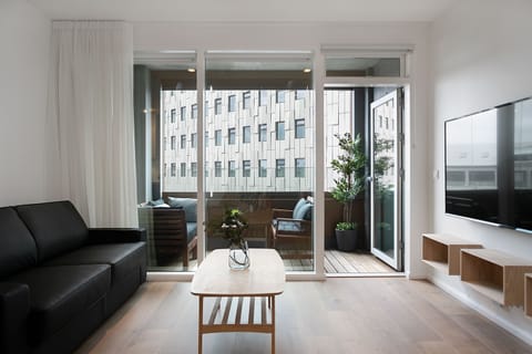 Premier Apartment, 2 Bedrooms, 2 Bathrooms | Living area | Flat-screen TV, heated floors