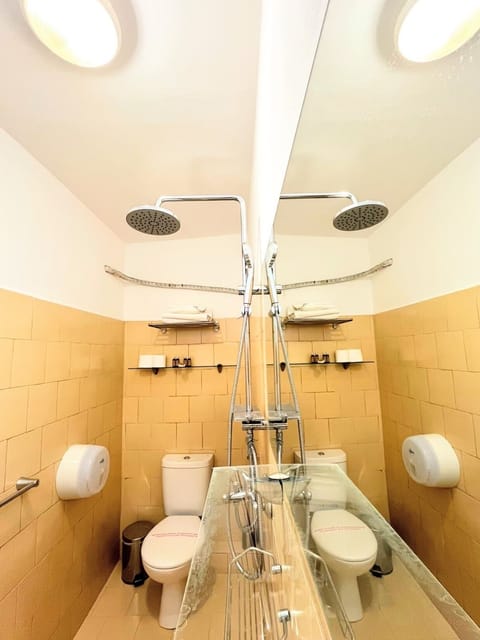 Economy Double Room, Patio | Bathroom | Shower, free toiletries, hair dryer, towels
