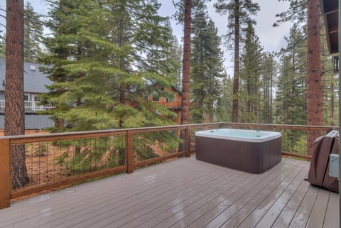 - Private hot tub on forest-view deck
- Relax among towering pine trees
- Mountain cabin rental with spa retreat