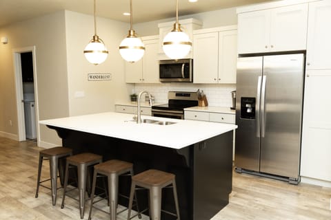 Kitchen island, appliances and seating