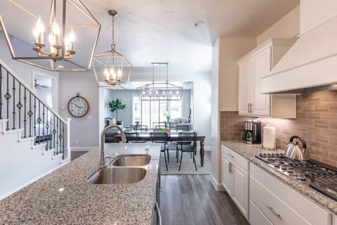 Kitchen - The Kitchen is complete with everything you will need for meal preparations including pots, pans, baking dishes, plates, cups, silverware, cutlery, and an assortment of cooking utensils.