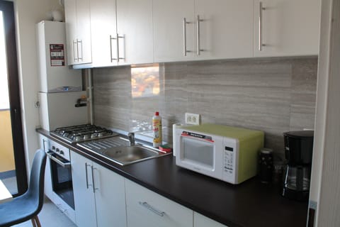 Apartment, Balcony | Private kitchen | Full-size fridge, microwave, stovetop, espresso maker