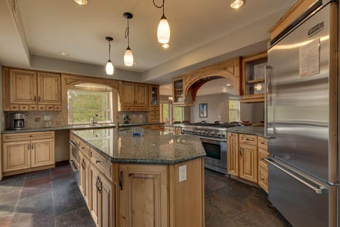 - Gourmet kitchen with large island counter
- Stainless steel Viking appliances included
- Mountain cabin rental with chef kitchen