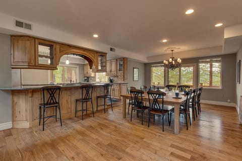 - Spacious dining area with seating for ten
- Rustic wood table and chandelier lighting
- Perfect family dining in mountain getaway