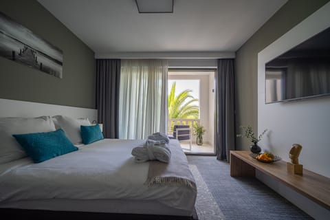 Deluxe Double Room, Pool View | Premium bedding, minibar, in-room safe, individually decorated