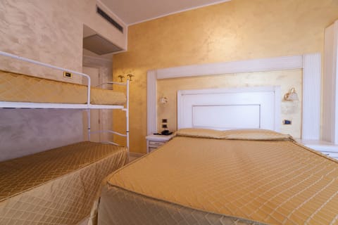 Standard Quadruple Room, Partial Sea View | 1 bedroom, minibar, in-room safe, desk