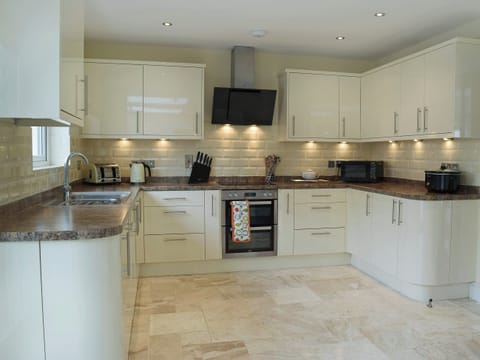 Open plan galley style kitchen | Y Hendy Llaeth, Red Roses, near Whitland