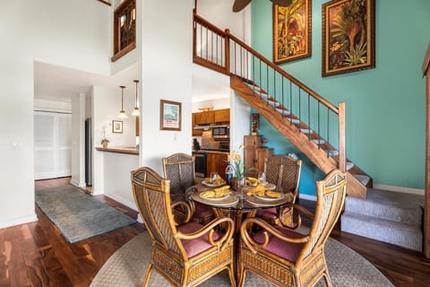 Indoor dining area with island flair and open sightlines to the kitchen and lanai.