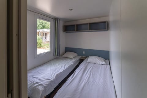 Get a peaceful night sleep in our cozy bedroom with 2 Single beds.