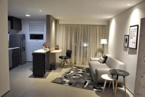 Deluxe Suite, Multiple Beds | Living area | Flat-screen TV