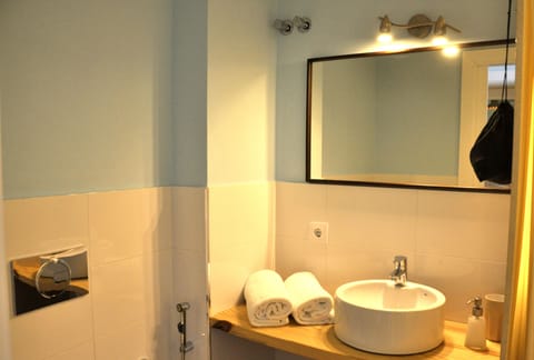 Suite, 1 King Bed, Jetted Tub | Bathroom | Shower, free toiletries, hair dryer, slippers