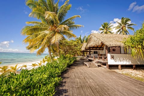 On the beach, white sand, sun loungers, beach towels