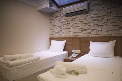 Economy Room | 1 bedroom, premium bedding, free minibar items, in-room safe