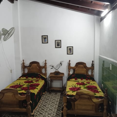 Triple Room | Minibar, iron/ironing board, WiFi, bed sheets