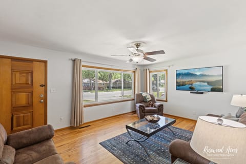 Feel right at home with this open living room with a 65" smart tv