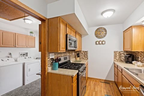Kitchen area that looks into laundry area