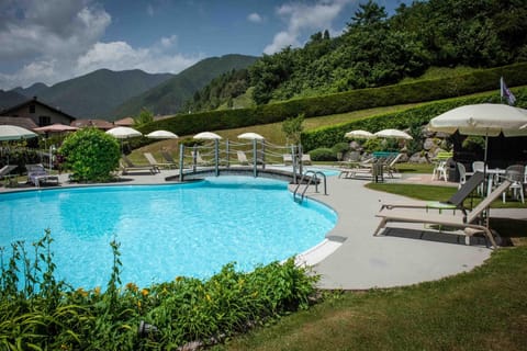 Seasonal outdoor pool, open 8:00 AM to 8:00 PM, pool umbrellas
