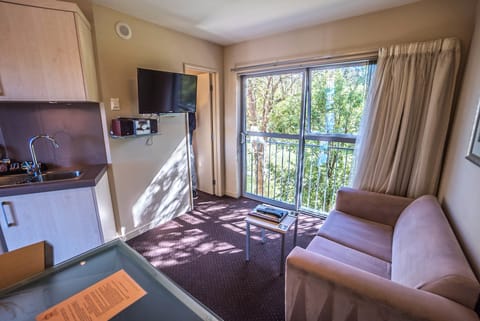 One-Bedroom Suite with Spa Bath | Living area | TV, DVD player