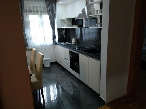 Family Apartment, Multiple Beds, Garden View | Private kitchen | Electric kettle