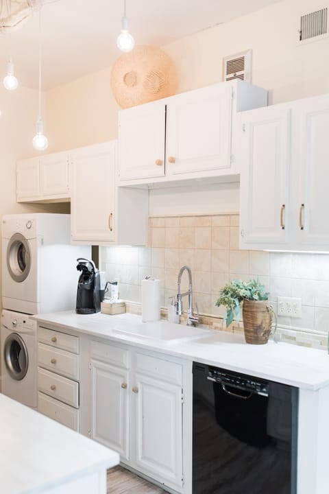 Second floor kitchen, with washer and dryer