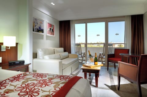 Junior Suite, Garden View | Premium bedding, free minibar, in-room safe, desk