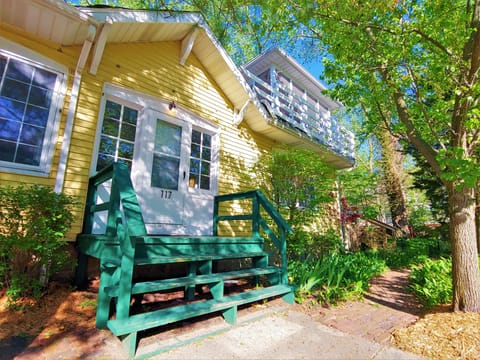 Front entry. Walkway around to back deck. View of 2nd floor screened porch.