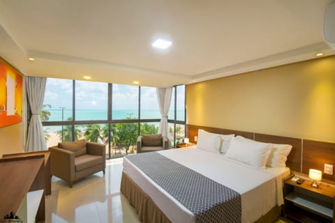 Suite, 1 King Bed, Sea Facing | Minibar, desk, blackout drapes, free WiFi