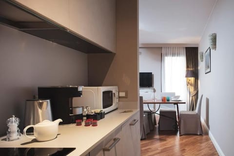 Apartment, 2 Bedrooms, Annex Building (Residenza Ducato Corte Contarina) | Private kitchen | Full-size fridge, microwave, stovetop, dishwasher