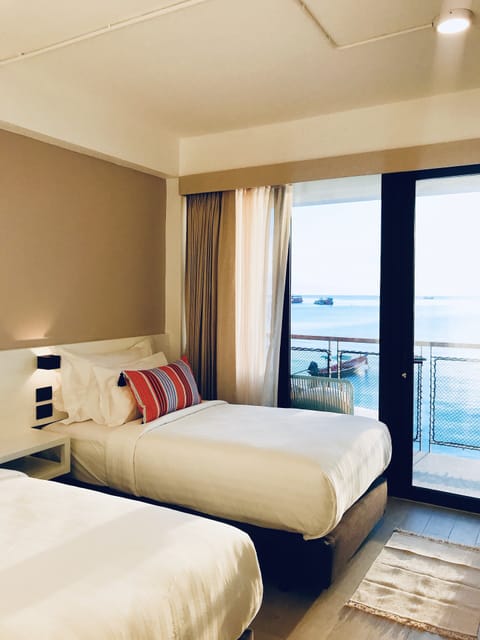 Sea View Superior Twin Room | Minibar, in-room safe, blackout drapes, iron/ironing board