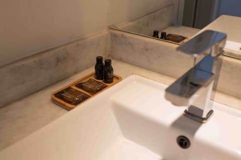 Shower, rainfall showerhead, hair dryer, towels