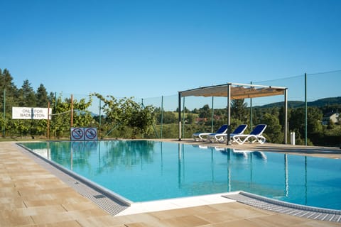 Seasonal outdoor pool, open 10 AM to 8 PM, pool umbrellas, sun loungers