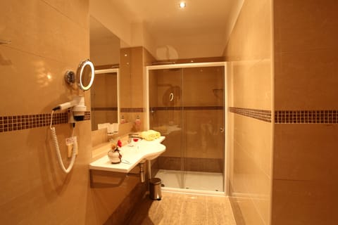 Suite | Bathroom | Rainfall showerhead, hair dryer, bathrobes, towels